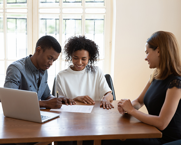 Corporate executives engaged in a strategic session to discuss the restructuring of company operations.